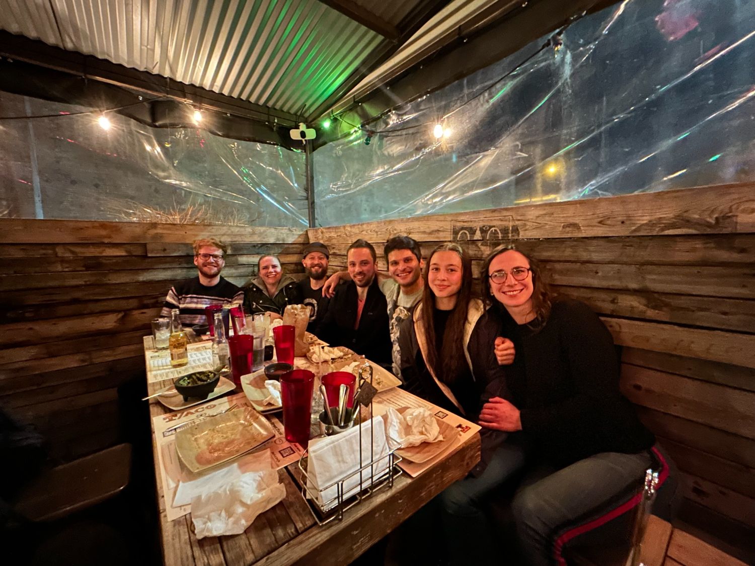 Members and trainers out to dinner together after a workout